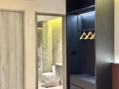 a bathroom with a toilet and a glass shower at 2min walk to TRX,KLCC view Gaming 2pax swimming pool in Kuala Lumpur