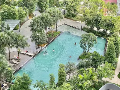 an overhead view of a swimming pool with people in it at 2min walk to TRX,KLCC view Gaming 2pax swimming pool in Kuala Lumpur