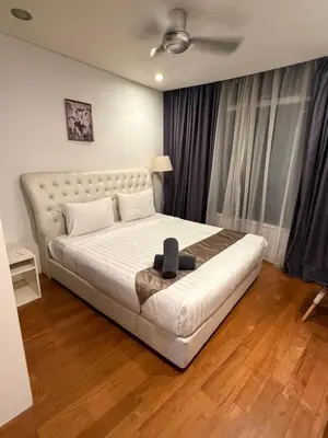 a bedroom with a large white bed in a room at Kuala-lumpur City View Vortex Apartment in Kuala Lumpur