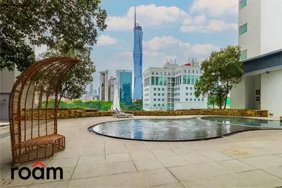 a swimming pool in the middle of a city at Dua Sentral Transit Suites KL Sentral in Kuala Lumpur
