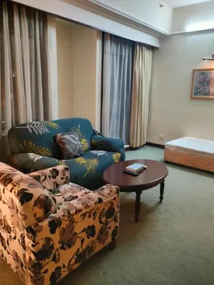 a living room with a couch and a coffee table at KL Brave Suite at Times Square in Kuala Lumpur