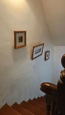 a room with three framed pictures on a wall at Cozy 2 Private Rooms in Taman Desa with Shared Bathroom in Kuala Lumpur