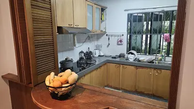 a kitchen with a bowl of fruit on a table at Cozy 2 Private Rooms in Taman Desa with Shared Bathroom in Kuala Lumpur