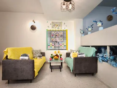 a living room with two couches and a table at KL Dorm 10 Min to Mid valley in Kuala Lumpur