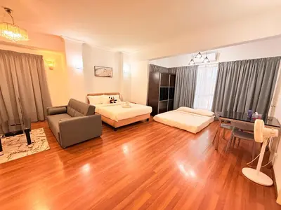a large living room with a bed and a couch at CozyHome Suites Casa Mutiara in Kuala Lumpur