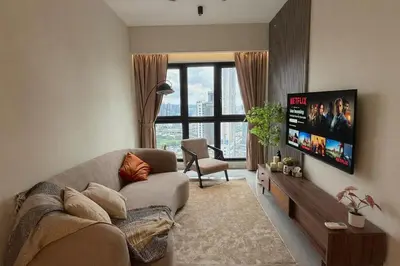a living room with a couch and a flat screen tv at 5PX Comfy 2BR Agile Bukit Bintang Walkable Pavilion, TRX & MRT in Kuala Lumpur