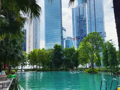 a swimming pool in a city with tall buildings at 5PX Comfy 2BR Agile Bukit Bintang Walkable Pavilion, TRX & MRT in Kuala Lumpur