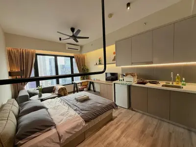 a kitchen with a large bed in a room at 5PX Comfy 2BR Agile Bukit Bintang Walkable Pavilion, TRX & MRT in Kuala Lumpur
