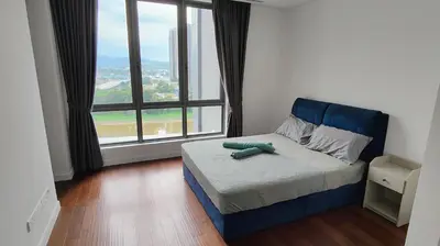 a bedroom with a bed with a blue headboard and a large window at Pomelo Meet Kuala Lumpur in Kuala Lumpur