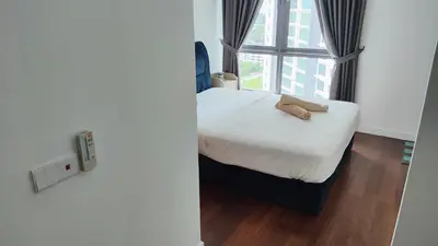 a small bedroom with a bed and a window at Pomelo Meet Kuala Lumpur in Kuala Lumpur