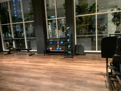 an empty room with a gym with windows at Premier suites at Quill Residence KL in Kuala Lumpur