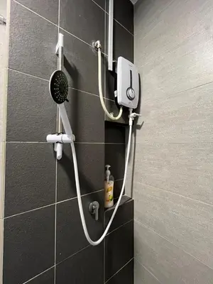 a shower with a hair dryer on a wall at Ampang 2pax Studio Ampang Point in Ampang