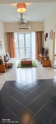 a living room with a large room with a large window at Greenstone At Seri Bukit Ceylon klcc in Kuala Lumpur
