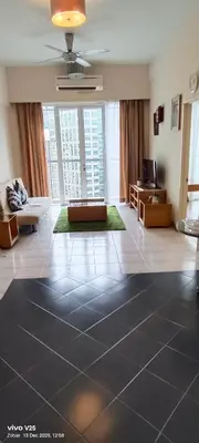 a large living room with a couch and a table at Greenstone At Seri Bukit Ceylon klcc in Kuala Lumpur
