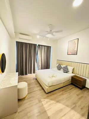 a bedroom with a white bed and a window at Agile Delima Sky View Apartment at TRX Bukit Bintang in Kuala Lumpur