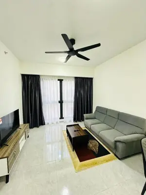 a living room with a couch and a ceiling fan at Agile Delima Sky View Apartment at TRX Bukit Bintang in Kuala Lumpur