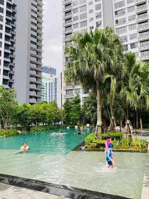 a group of people in a swimming pool in a city at Agile Bukit Bintang Homestay KLCC in Kuala Lumpur