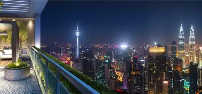 a view of a city skyline at night at Agile Bukit Bintang Homestay KLCC in Kuala Lumpur