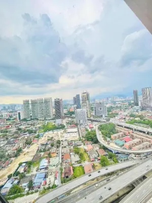 an aerial view of a city with traffic at Scarletz Residence KLCC Rooftop Pool in Kuala Lumpur