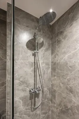 a shower with a glass door in a bathroom at Agile Bukit Bintang By NexxField in Kuala Lumpur
