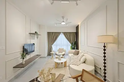 a living room with a couch and a tv at Agile Bukit Bintang By NexxField in Kuala Lumpur
