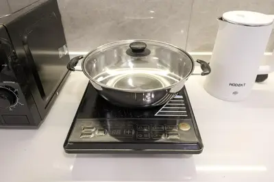 a bowl is sitting on top of a stove at Agile Bukit Bintang By NexxField in Kuala Lumpur