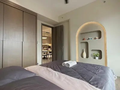 a bedroom with a large bed and a mirror at 3PX Deluxe Suites Agile Bukit Bintang, Walkable Pavilion & TRX & MRT in Kuala Lumpur