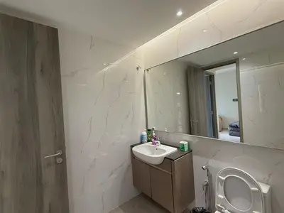 a bathroom with a sink and a mirror at 3PX Deluxe Suites Agile Bukit Bintang, Walkable Pavilion & TRX & MRT in Kuala Lumpur