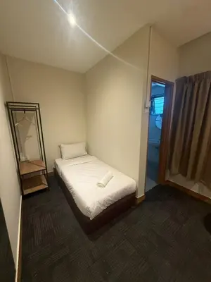 a small bedroom with a bed and a mirror at iBilik - Velocity Kuala Lumpur in Kuala Lumpur