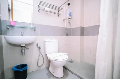 a bathroom with a toilet and a sink at iBilik - Velocity Kuala Lumpur in Kuala Lumpur