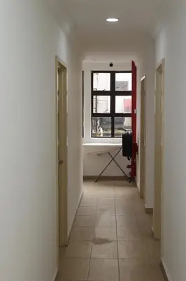a hallway with a window and a camera in a room at Haven Hotel Pudu in Kuala Lumpur