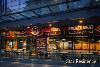 a restaurant with signs on the side of a building at The Global Star Residences At KLCC in Kuala Lumpur