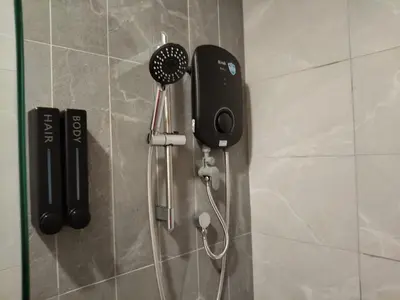 a shower with a blow dryer on the wall at Kampung Marsa at Majestic Residence, Kuala Lumpur in Kuala Lumpur