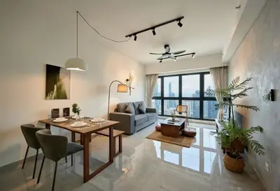 a living room with a table and a couch at City Haven Bukit Bintang,KLCC,Pavillion in Kuala Lumpur