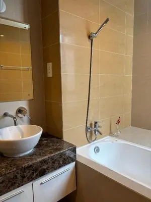 a bathroom with a sink and a shower and a tub at 183 Ampang KLCC by Widebed in Kuala Lumpur