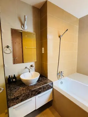 a bathroom with a sink and a bath tub at 183 Ampang KLCC by Widebed in Kuala Lumpur