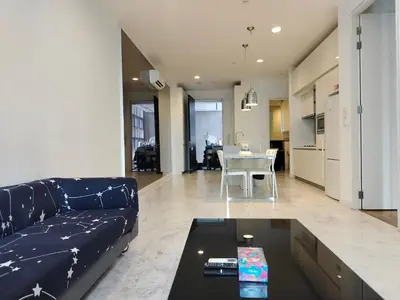 a living room with a couch and a table at Platinum Klcc by PureStay in Kuala Lumpur