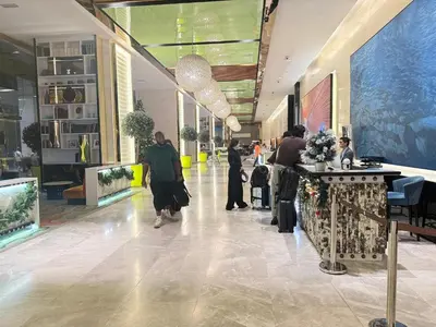 a group of people walking through a shopping mall at Platinum Klcc by PureStay in Kuala Lumpur