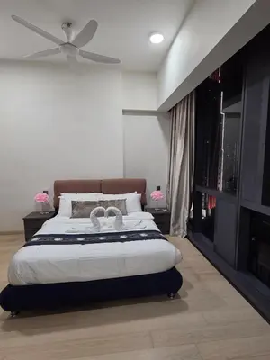 a bedroom with a bed with a ceiling fan at KL Star Residance KLCC by Nexus 111 in Kuala Lumpur