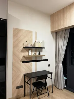 a dining room with a table and a shelf on the wall at Star residence in Kuala Lumpur