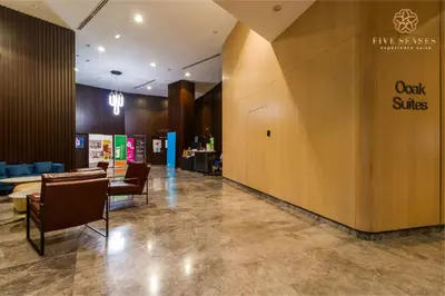 a lobby with chairs and a sign that reads oak skies at The Ooak Suites Kiara 163 by Five Senses in Kuala Lumpur