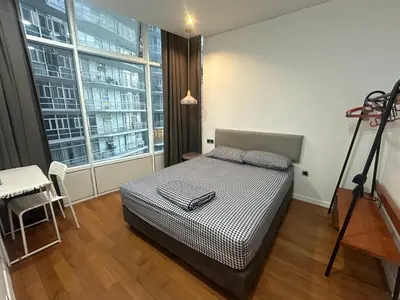 a bedroom with a bed and a large window at Z-Home-skysuite \u4e24\u623f\u4e24\u536b in Kuala Lumpur