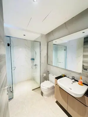 a bathroom with a toilet and a sink and a shower at Agile Bukit Bintang Sky Pavillion at TRX in Kuala Lumpur
