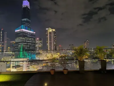 a view of a city skyline at night at The Excellent Axon Residence Bukit Bintang KL in Kuala Lumpur