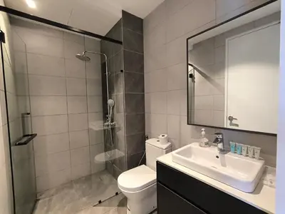 a bathroom with a toilet and a sink and a shower at The Excellent Axon Residence Bukit Bintang KL in Kuala Lumpur
