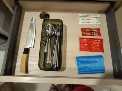 a drawer with utensils on top of a shelf at Kampung Marsa Retreat, Majestic Residence, KL in Kuala Lumpur