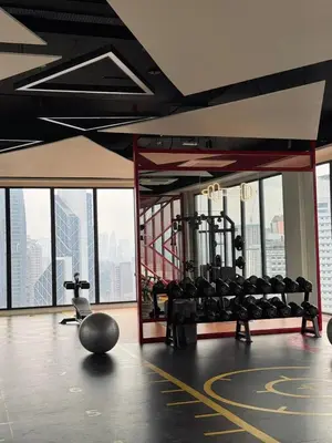 a gym with a lot of equipment in a building at Kampung Marsa Retreat, Majestic Residence, KL in Kuala Lumpur