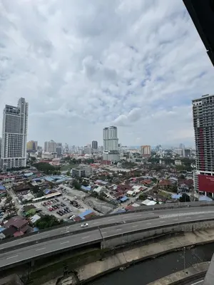 a view of a city with a highway and buildings at 2 Bedroom Apartment Near KLCC 5 minutes Walk in Kuala Lumpur