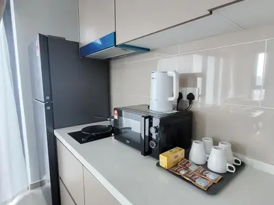 a kitchen with a coffee maker on a counter at Isola KLCC Residence in Kuala Lumpur