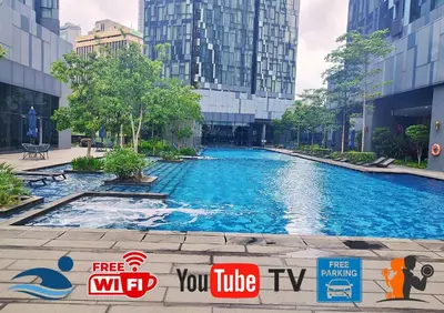 a large swimming pool in a city with tall buildings at Star Executive View KLCC in Kuala Lumpur